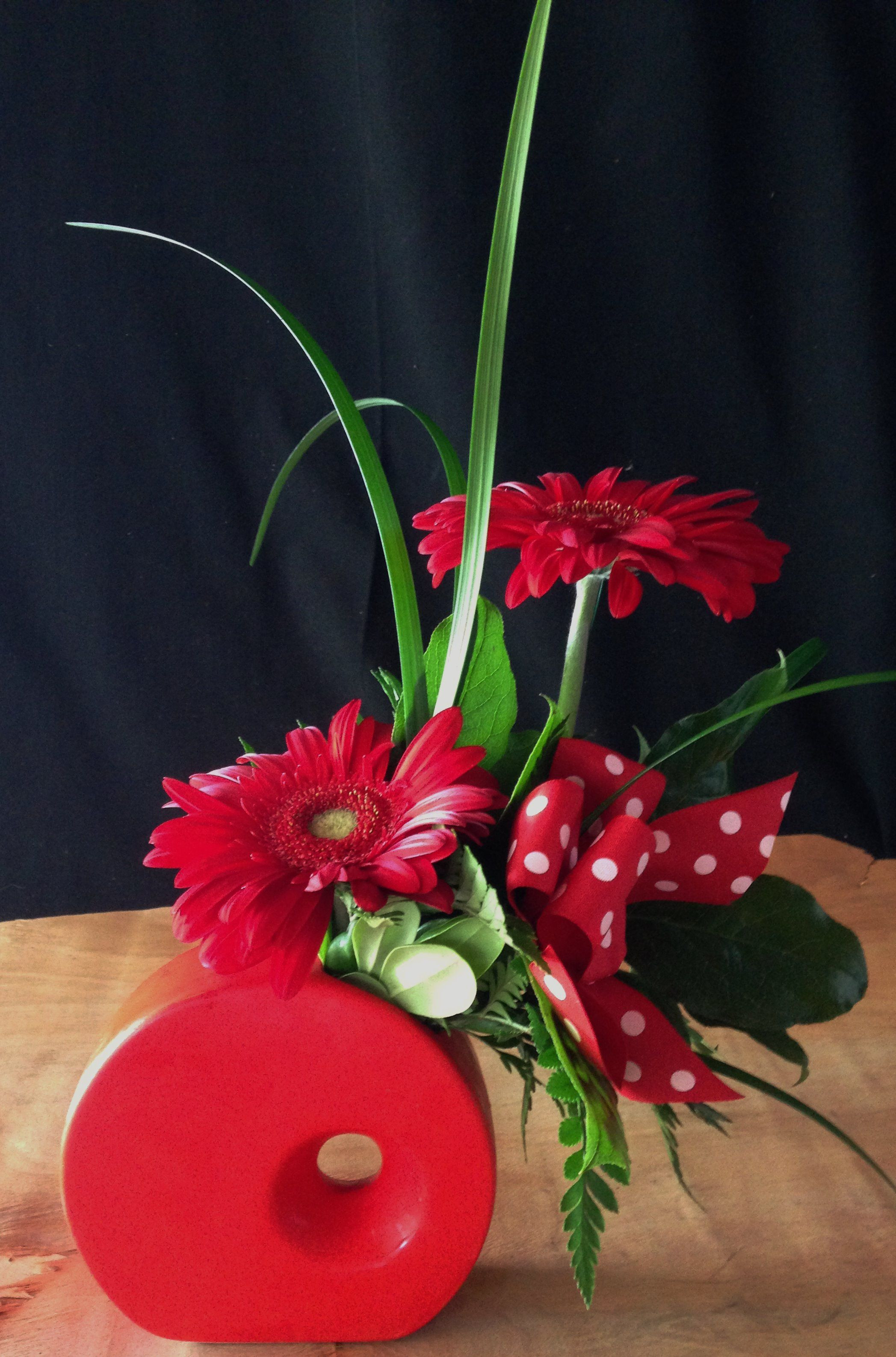 daisies in a vase of red ceramic vase image funky red ceramic vase filled with red in funky red ceramic vase filled with red gerbera daisies and a polka
