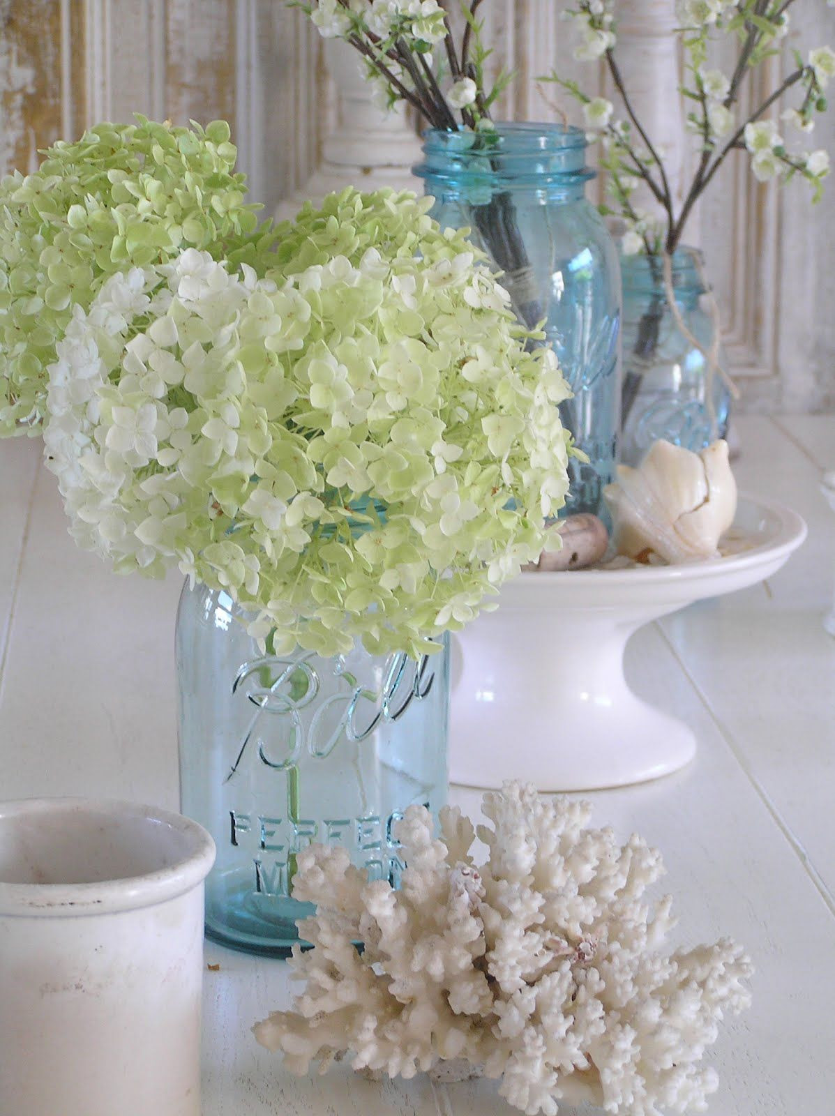 white mason jar vase of hydrangeas in mason jar with coral nautical accents or starfish for within hydrangeas in mason jar with coral nautical accents or starfish for dacor we could use pink white and blue hydrangeas